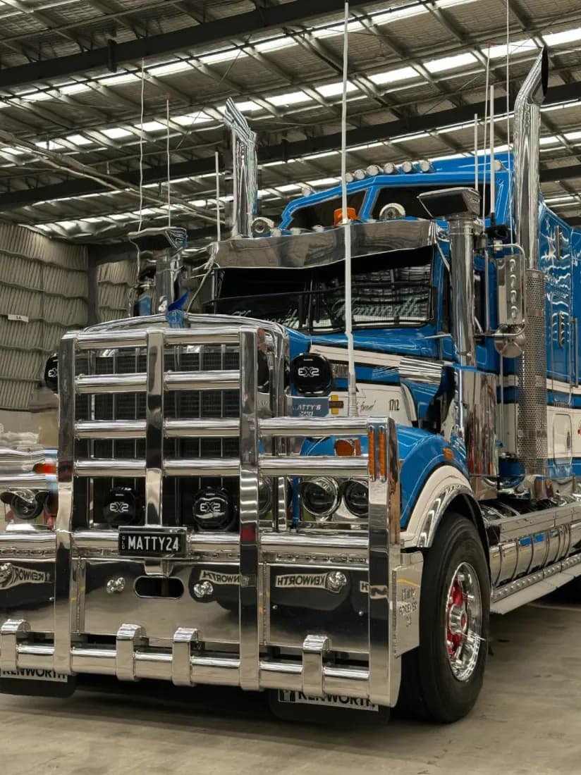 Blue Kenworth detailed inside the wash bay