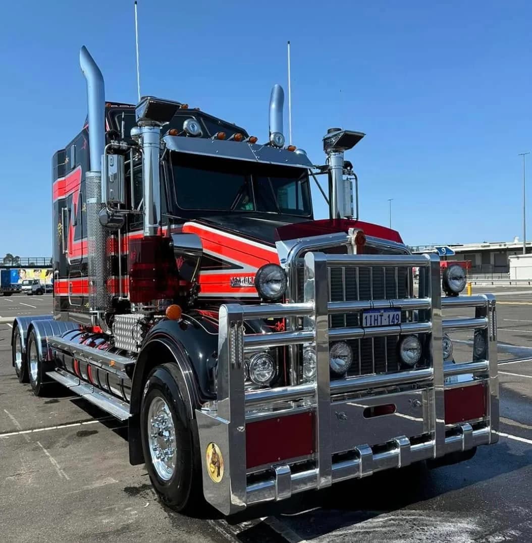 Black and red Kenworth detailed in the sun